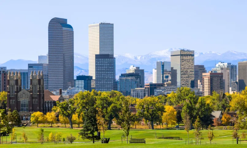 Denver Colorado. Mile High City. Rocky Mountains. Downtown Denver Colorado view from a park with the mountains in the background