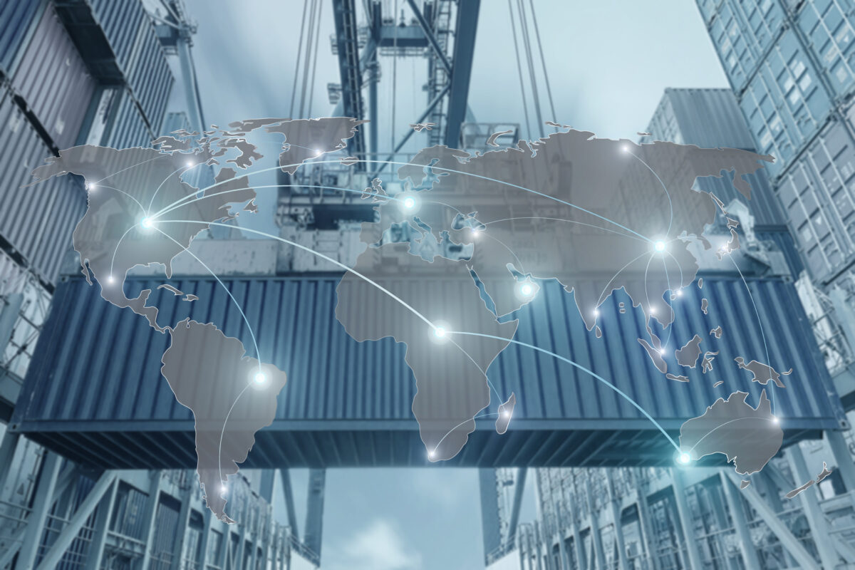 A crane lifts a large shipping container in a bustling port, with stacks of containers in the background. A translucent world map overlays the scene, featuring glowing nodes and connecting lines that represent global trade routes and international logistics hubs.